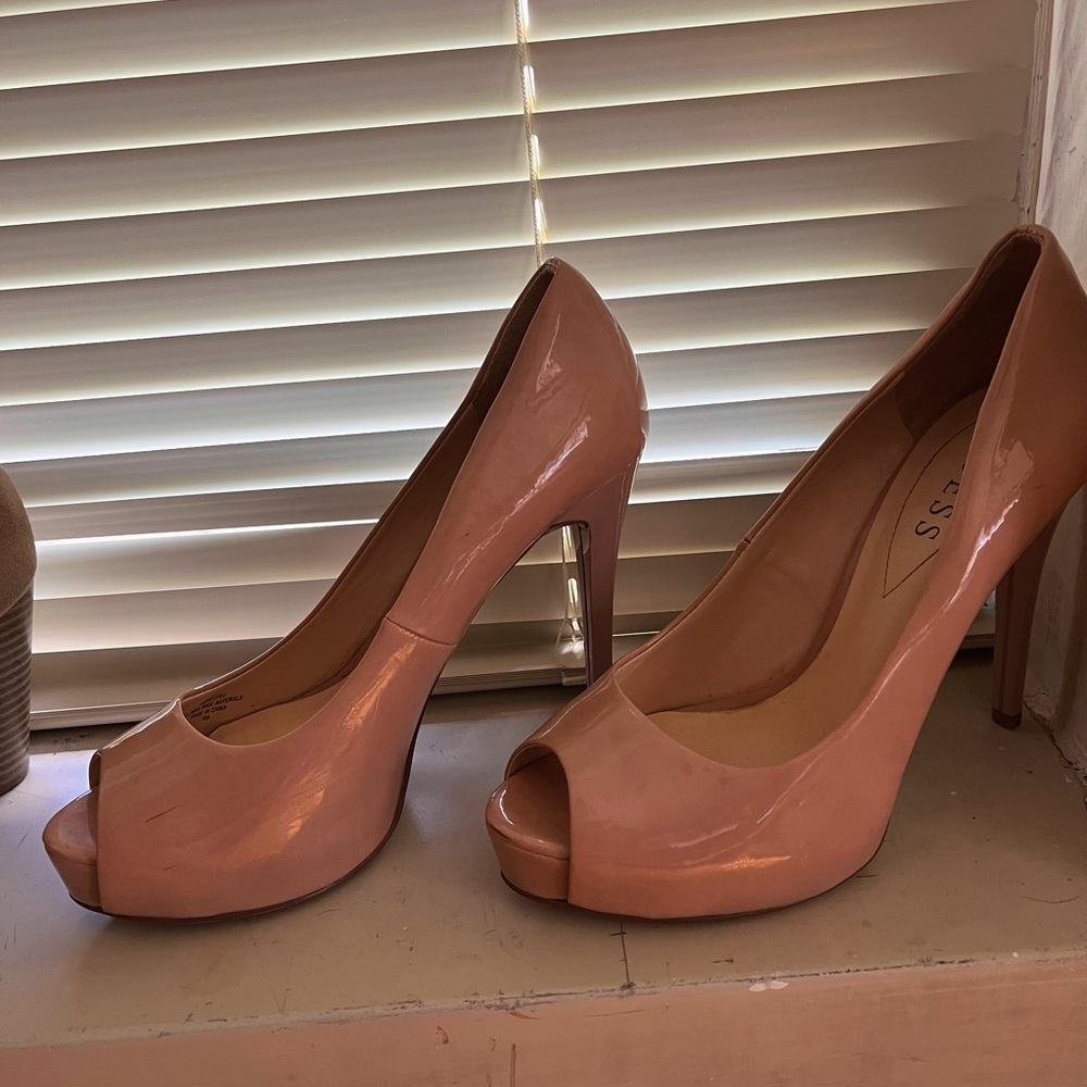 Cream colored open toed pumps.